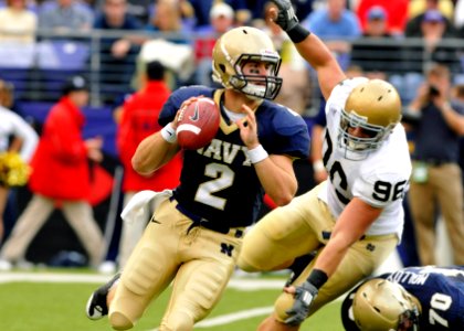 US Navy 081115-N-4565G-053 Navy quarterback Jarod Bryant (^2), from Hoover, Alabama, eludes Notre Dame defensive end Pat Kuntz (^96) during a first quarter pass attempt in the Saturday, Nov. 15, 2008 college football game