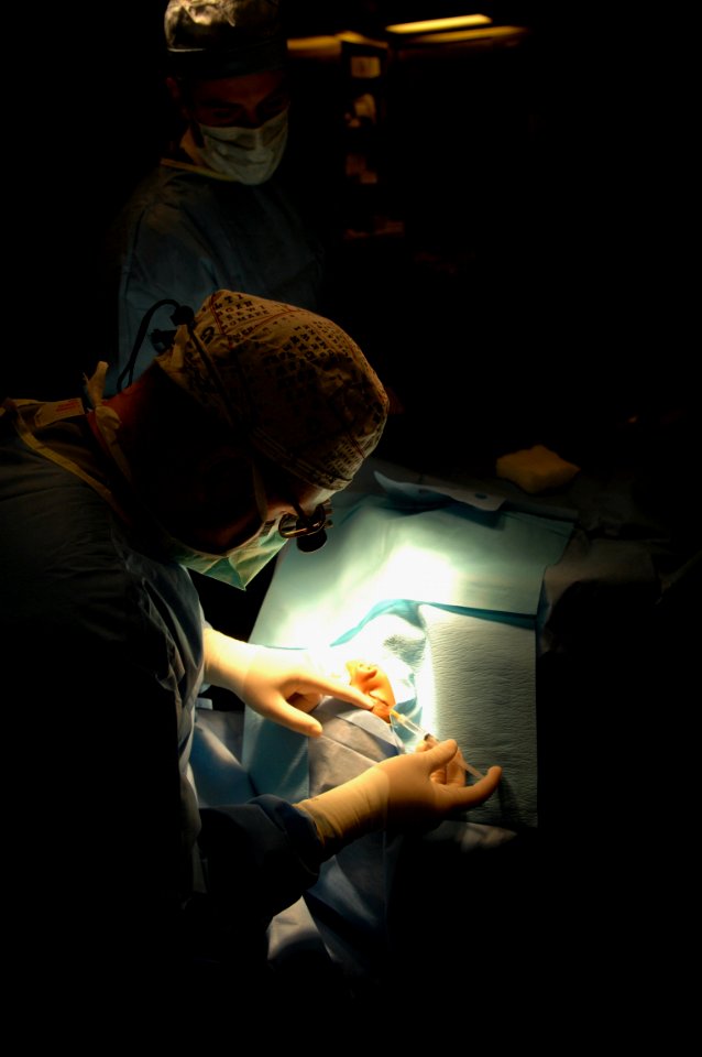 US Navy 081115-N-7544A-085 Cmdr. Brian Alexander, an ophthalmologist embarked aboard the amphibious assault ship USS Kearsarge (LHD 3), performs eye surgery on a 3-year-old girl