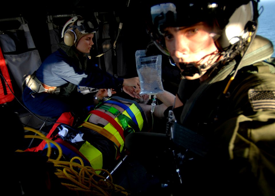 US Navy 081112-N-9620N-015 Navy personnel provide medical aid to a Norwegian man during a search and rescue medical evacuation from the ocean-going tug SVC Tanux II