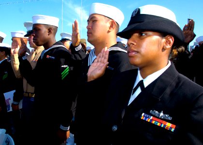 US Navy 081111-N-3925A-006 ailors and Marines take the oath of allegiance during a naturalization ceremony aboard the aircraft carrier USS Midway Museum in San Diego Bay. Secretary of Homeland Security the Hon. Michael Chertoff