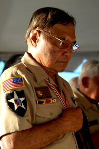 US Navy 081111-N-5476H-020 Abilino Bagaya of the Veterans of Foreign Wars Post 1572 Waipahu, Hawaii, bows his head for a moment of silence during a Veterans Day sunset service