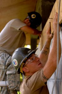 US Navy 081116-N-1508S-153 Builder 2nd Class Sean Roberts makes repairs to a hospital in Guyana photo