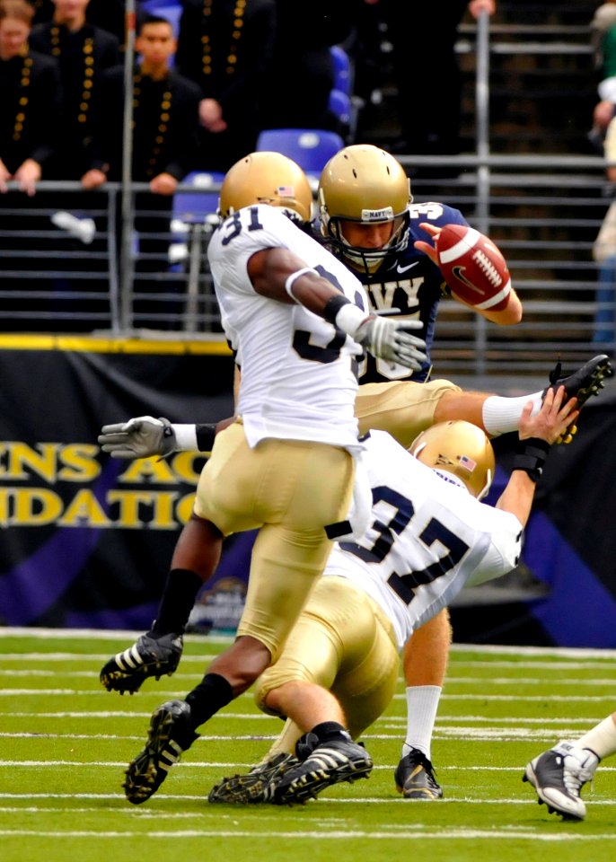 US Navy 081115-N-4565G-071 Notre Dame cornerback Mike Anello (^37) blocks a punt by Midshipman Kyle Delahooke in the first quarter of the Saturday, Nov. 15, 2008 college football game between the U.S. Naval Academy and the Univ