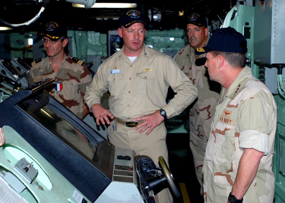 US Navy 081112-N-0803S-001 Cmdr. Kurt Kastner, center, commanding officer of the amphibious transport dock ship USS San Antonio (LPD 17) describes the capabilities of the ship to Vice Adm. Bill Gortney