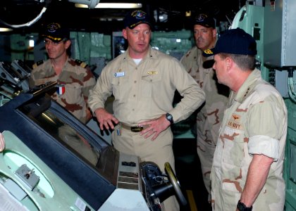 US Navy 081112-N-0803S-001 Cmdr. Kurt Kastner, center, commanding officer of the amphibious transport dock ship USS San Antonio (LPD 17) describes the capabilities of the ship to Vice Adm. Bill Gortney