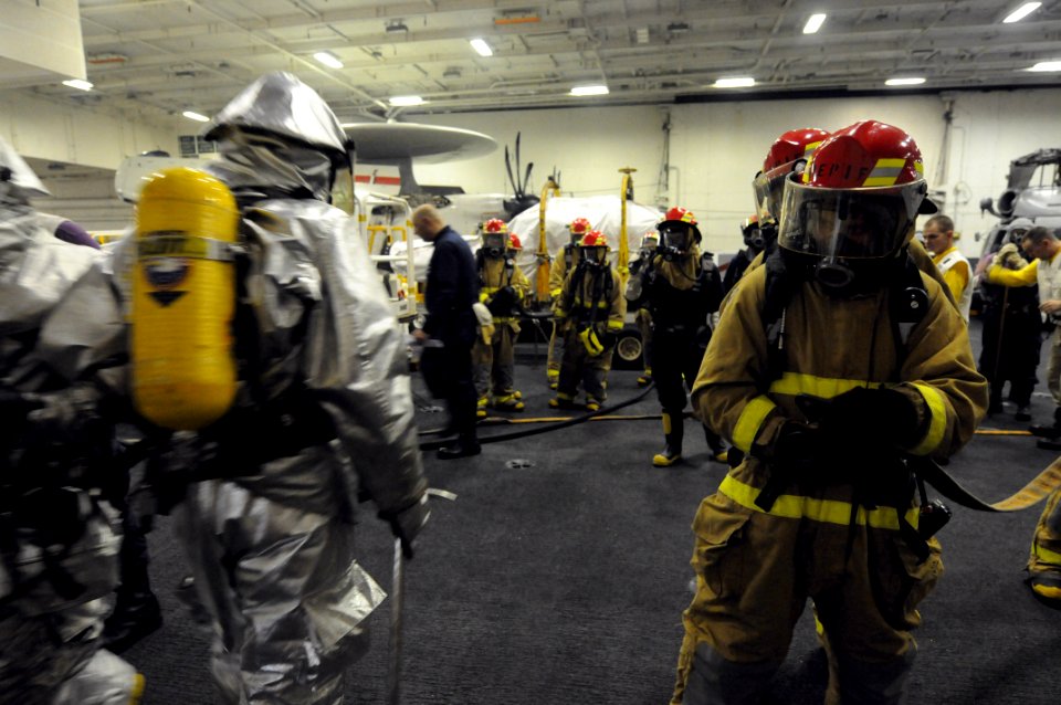 US Navy 081114-N-3659B-566 Sailors stand by outside a simulated fuel station fire