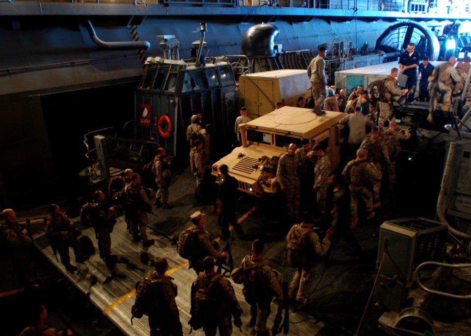 US Navy 081117-N-4236E-039 Marines embark aboard a landing craft air cushion from Assault Craft Unit (ACU) 4