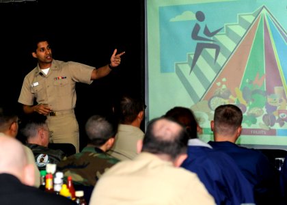 US Navy 081114-N-8546L-023 Lt. Amit Sood, a clinical dietitian at U.S. Naval Hospital Yokosuka, teaches the crew of the amphibious command ship USS Blue Ridge (LCC 19) about healthy living through maintaining a well balanced di