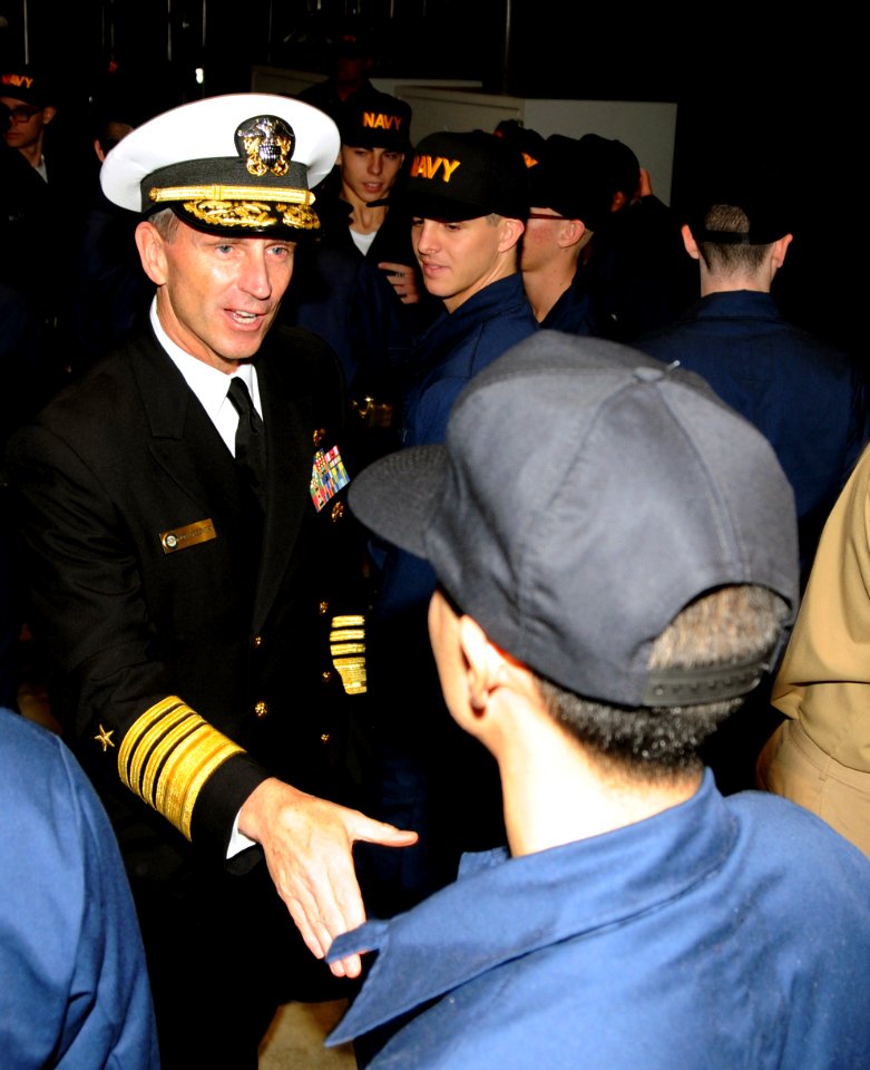 US Navy 081114-N-8848T-431 Adm. Jonathan W. Greenert congratulates a recruit following a capping ceremony