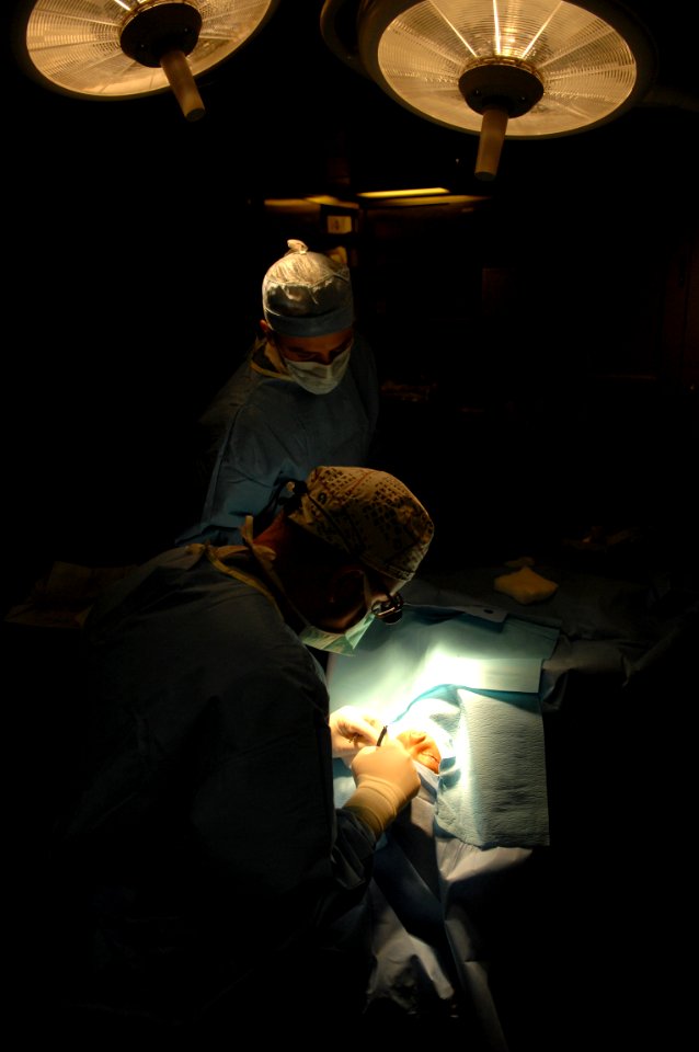 US Navy 081115-N-7544A-097 Cmdr. Brian Alexander, an ophthalmologist embarked aboard the amphibious assault ship USS Kearsarge (LHD 3), performs eye surgery on a 3-year-old girl