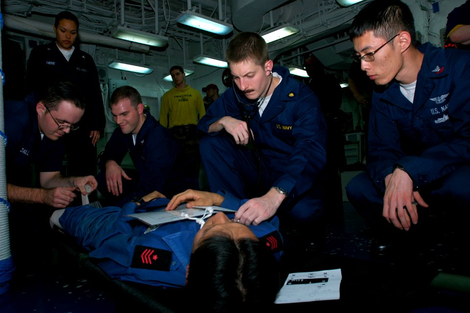 US Navy 081115-N-9950J-027 Doctors and corpsmen treat a simulated Japanese victim during a mass casualty drill in flight-deck triage aboard the amphibious assault ship USS Essex (LHD 2)
