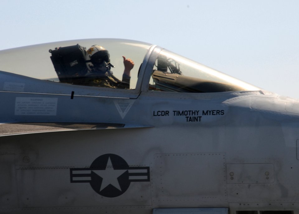 US Navy 100520-N-6509M-462 Lt. Cmdr. Timothy Myers gives a thumbs up after making an arrested landing in his F-A-18E Super Hornet