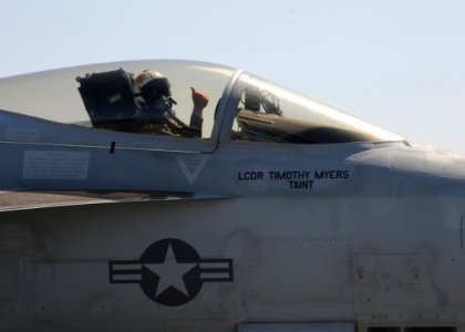 US Navy 100520-N-6509M-462 Lt. Cmdr. Timothy Myers gives a thumbs up after making an arrested landing in his F-A-18E Super Hornet