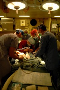 US Navy 081115-N-7544A-221 Continuing Promise 2008 medical personnel embarked aboard the amphibious assault ship USS Kearsarge (LHD 3) prepare a patient for eye surgery photo