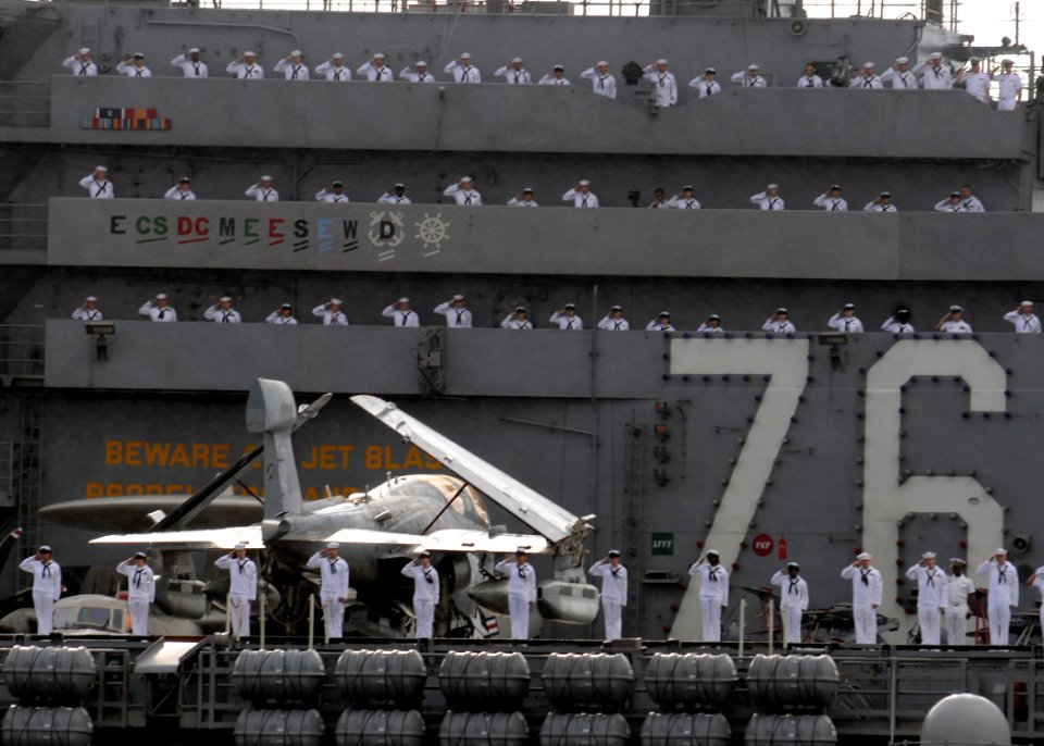 US Navy 081117-N-9758L-078 Sailors render honors as the ship passes the USS Arizona Memorial