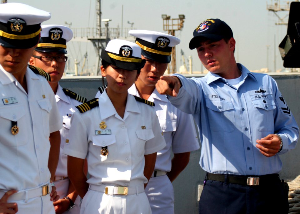 US Navy 081118-N-6764G-089 Boatswain's Mate 2nd Class Charles Stillinger explains foc'sle operations to Republic of Korea Midshipmen