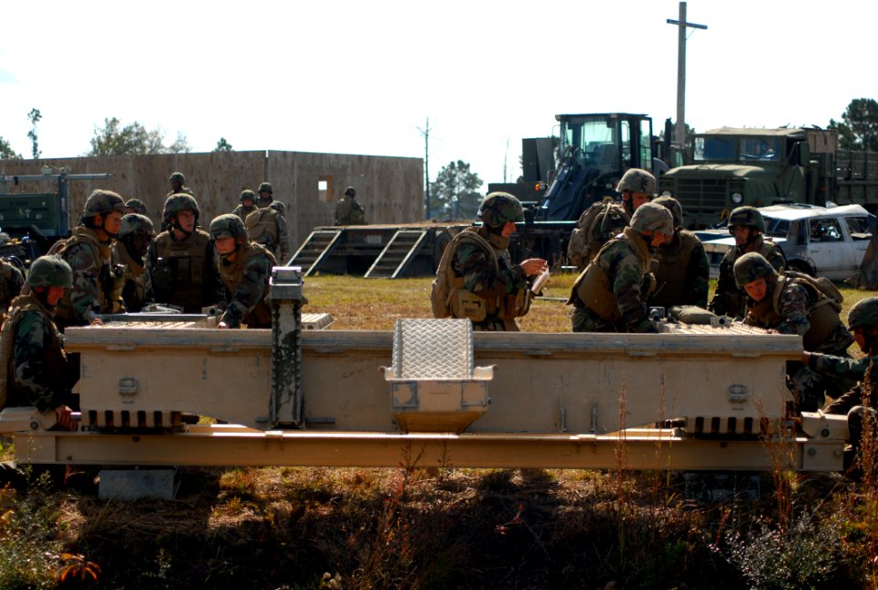 US Navy 081114-N-7367K-027 Builder 1st Class Nathan Jacobs supervises the launching of a medium girder bridge