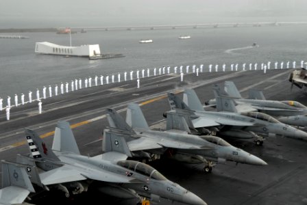 US Navy 081117-N-1635S-003 Sailors man the rails on the flight deck of the Nimitz-class aircraft carrier USS Ronald Reagan (CVN 76)