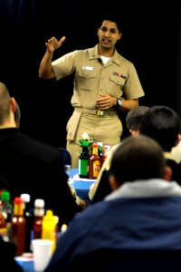 US Navy 081114-N-8546L-198 Lt. Amit Sood, a clinical dietitian at U.S. Naval Hospital Yokosuka, teaches the crew of the amphibious command ship USS Blue Ridge (LCC 19) about healthy living through maintaining a well balanced di