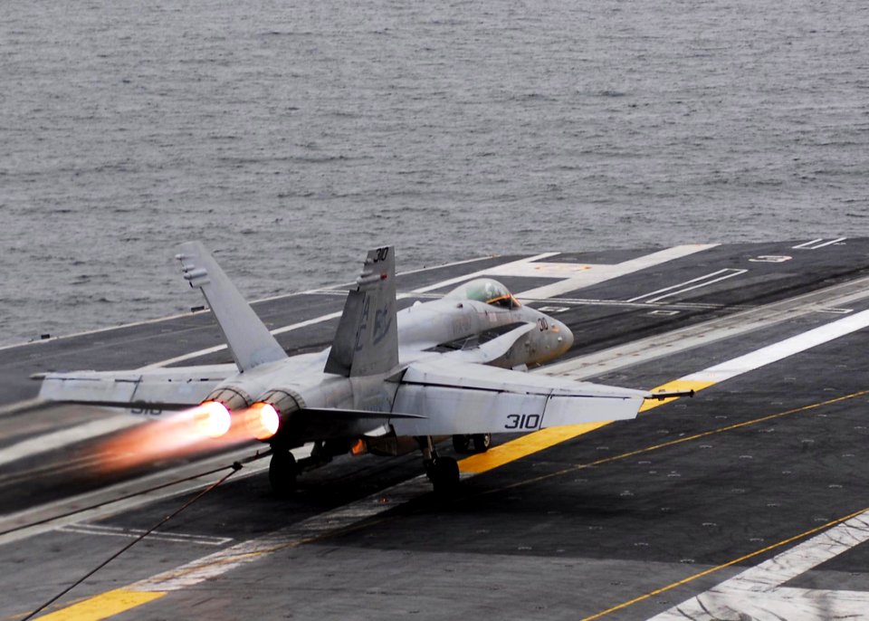 US Navy 081117-N-5033P-040 An F-A-18 Hornet recovers on the flight deck of the Nimitz-class aircraft carrier USS Dwight D. Eisenhower (CVN 69)