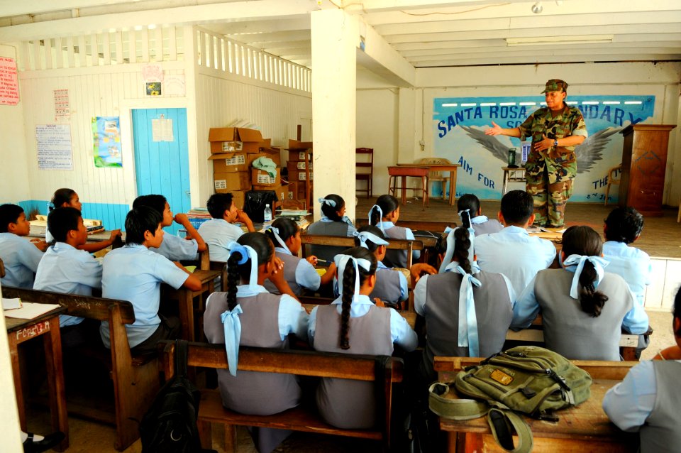 US Navy 081119-N-4515N-029 Lt. Cmdr. Celeste Santana, a member of the medical team embarked aboard the amphibious assault ship USS Kearsarge (LHD 3), gives children at the Santa Rosa Secondary School a preventive medicine healt