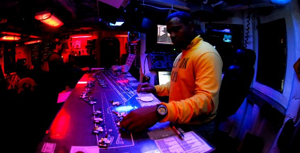 US Navy 081115-N-6538W-158 Chief Aviation Boatswain's Mate Keith Miller organizes aircraft templates on the