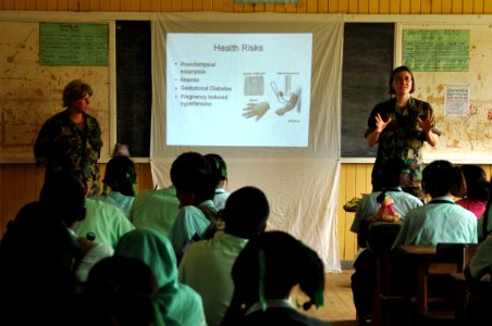 US Navy 081120-N-8907D-142 Cmdr. Andrea Parodi and Lt. j.g. Molly Moffatt give a pregnancy awareness class to the students of Port Kaituma Secondary School