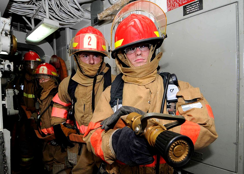 US Navy 100514-N-1082Z-101 Sailors participate in a damage control fire drill aboard the amphibious dock landing ship USS Ashland (LSD 48)