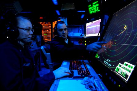 US Navy 081117-N-9950J-004 Air Traffic Controller 2nd Class Erin McHenry, of Wichita, Kan., and Air Traffic Controller Airman Apprentice Adam Minkel, of Pipestone, Minn., track aircraft on a radar console
