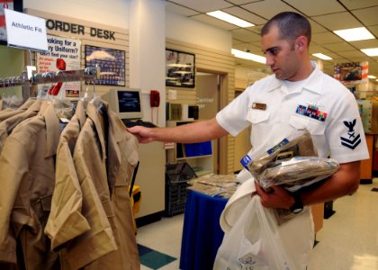 US Navy 081115-N-9758L-006 Yeoman 2nd Class Richard Moseley shops for the new service uniform at the Navy Exchange Uniform Shop