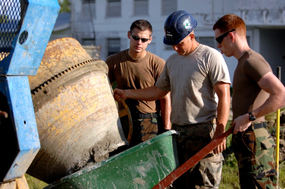 US Navy 081118-N-1508S-007 Engineers embarked aboard the amphibious assault ship USS Kearsarge (LHD 3) mix cement to be used for a new walkway at West Demerara Regional Hospital photo