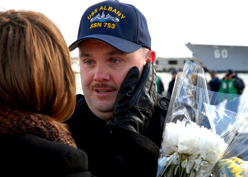 US Navy 081118-N-7668G-117 enior Chief Fire Control Technician Keith Nelson greets his wife upon the return of the Los Angeles-class attack submarine USS Albany (SSN 753) to Naval Station Norfolk