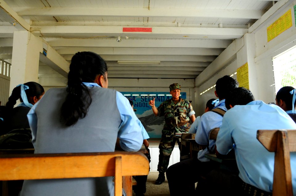 US Navy 081119-N-4515N-050 Lt. Cmdr. Celeste Santana, a member of the medical team embarked aboard the amphibious assault ship USS Kearsarge (LHD 3), gives children at the Santa Rosa Secondary School a preventive medicine healt