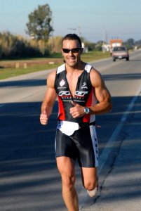 US Navy 081122-N-3289C-208 A Spanish participant completes the first five kilometers of the 10-kilometer foot race during Naval Station Rota's Morale Welfare and Recreations duathlon