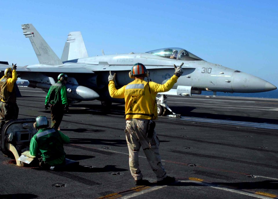US Navy 081119-N-9900B-010 An F-A-18C Hornet prepares to launch from the flight deck of USS Theodore Roosevelt (CVN 71)