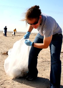 US Navy 081119-N-6764G-012 Hospital Corpsman 3rd Class Nicole Peckwith participates in a community relations project collecting trash