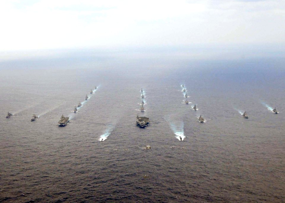 US Navy 081119-N-9565D-063 U.S. Navy and Japan Maritime Self-Defense Force ships steam in a 20-ship formation surrounding the aircraft carrier USS George Washington (CVN 73)