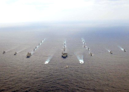 US Navy 081119-N-9565D-063 U.S. Navy and Japan Maritime Self-Defense Force ships steam in a 20-ship formation surrounding the aircraft carrier USS George Washington (CVN 73)