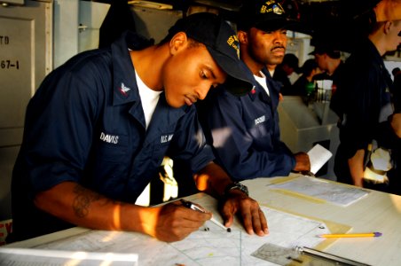 US Navy 081117-N-8546L-071 Quartermaster 3rd Class Shedrick Davis plots a course back to the amphibious command ship USS Blue Ridge's (LCC 119) homeport of Yokosuka, Japan