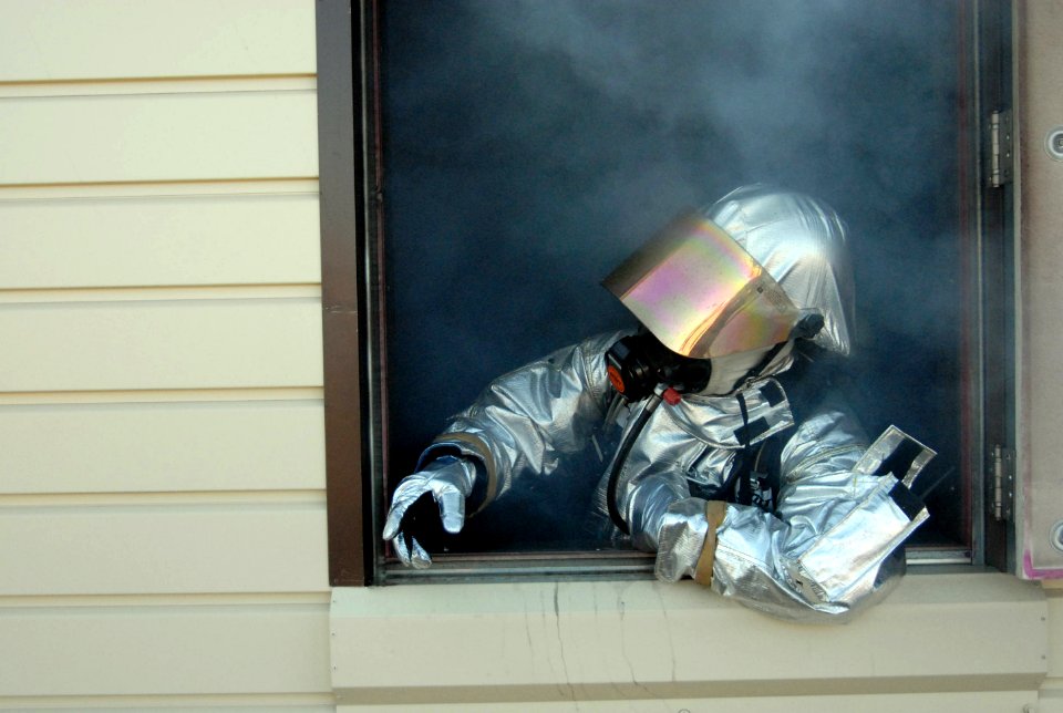 US Navy 081126-N-3289C-087 Battalion Chief Christopher Hubmer looks out the window after conducting a burn exercise