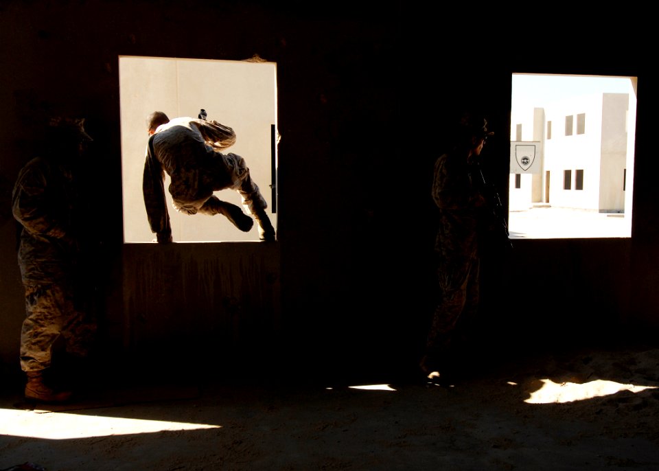 US Navy 081120-N-6278K-328 Marines advance through buildings during a bilateral urban assault training