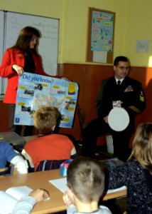 US Navy 081118-N-5483N-001 Chief Cryptologic Technician (Technical) Kevin Murphy, assigned to the amphibious command ship USS Mount Whitney (LCC 20), explains to 5th grade students at Secondary School Petko R. Slaveykov in Varn