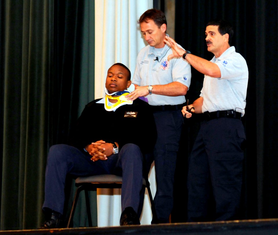 US Navy 081119-N-5345W-012 Paramedics lecture the audience about auto accident trauma response procedures during the driving safety seminar