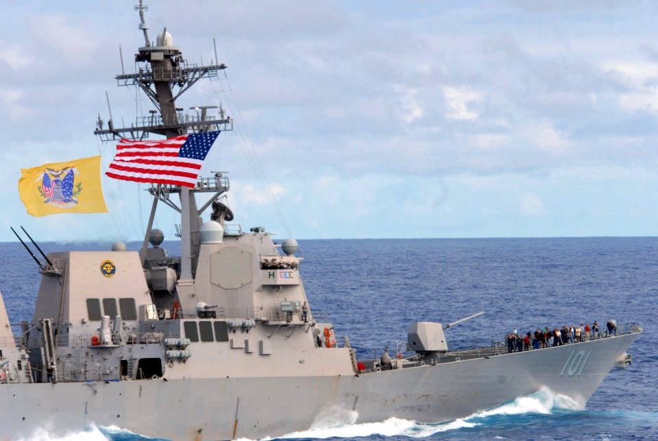 US Navy 081121-N-7730P-082 The Arleigh Burke-class guided-missile destroyer USS Gridley (DDG 101) flies both its battle flag and the ceremonial ensign as it performs a pass and review with the Nimitz-class aircraft carrier USS