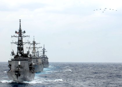 US Navy 081119-N-6936D-369 U. S. Navy and Japanese Maritime Self-Defense Force ships and aircraft maneuver into formation as part of the bilateral exercise ANNUALEX