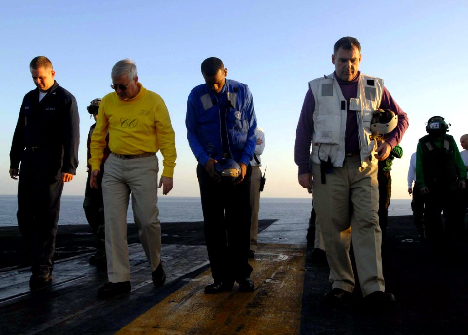 US Navy 081123-N-8822R-001 Capt. Ladd Wheeler and Command Master Chief Christopher Engles join Seaman Christopher Allen in a foreign object damage walk down