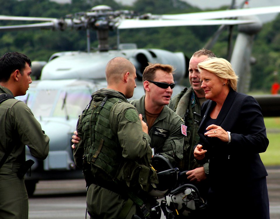 US Navy 081125-N-0000X-001 Barbara Stephenson nd Lt. Cmdr. Cory Christensen greet members of the helicopter aircrew from the guided-missile frigate Samuel B. Roberts (FFG 58)