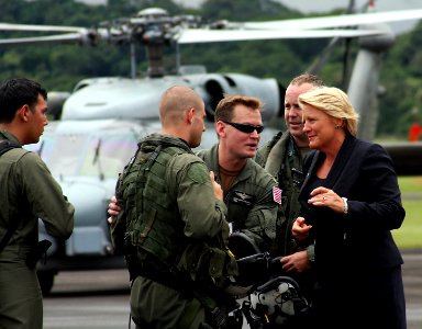 US Navy 081125-N-0000X-001 Barbara Stephenson nd Lt. Cmdr. Cory Christensen greet members of the helicopter aircrew from the guided-missile frigate Samuel B. Roberts (FFG 58)