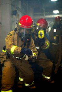 US Navy 081201-N-2013O-010 Sailors fight a simulated fire aboard the amphibious command ship USS Blue Ridge (LCC 19)