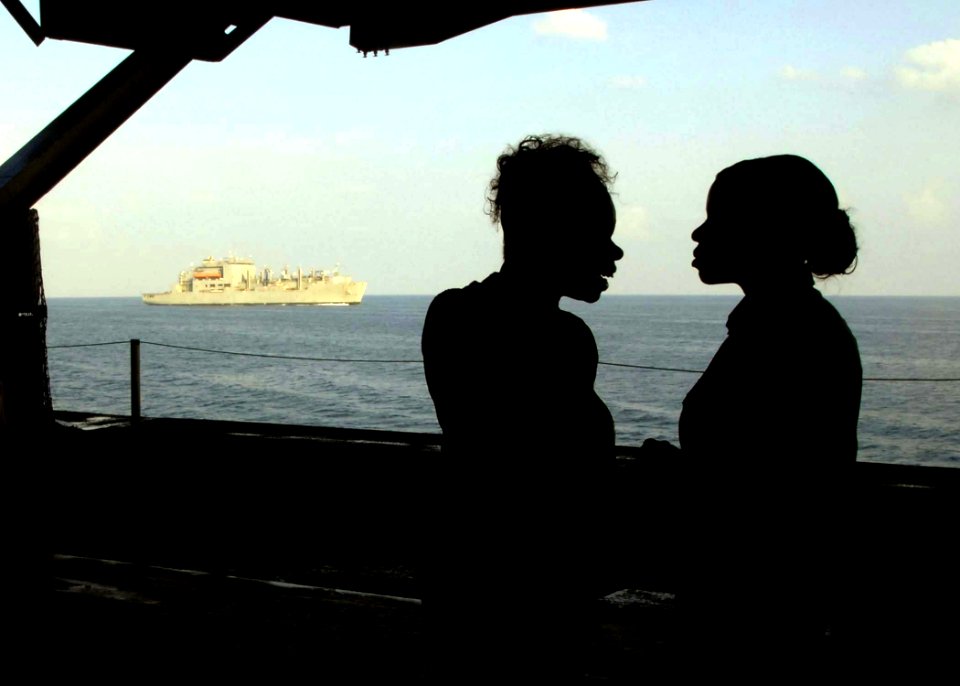 US Navy 081127-N-8822R-059 Jaqueline Easley shows her daughter her ship from the hangar bay of aircraft carrier USS Theodore Roosevelt (CVN 71)